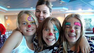 Four smiling girls with face paint