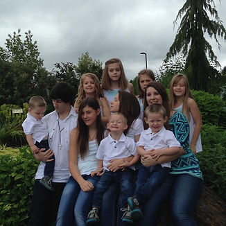 Large family group gathered outdoors