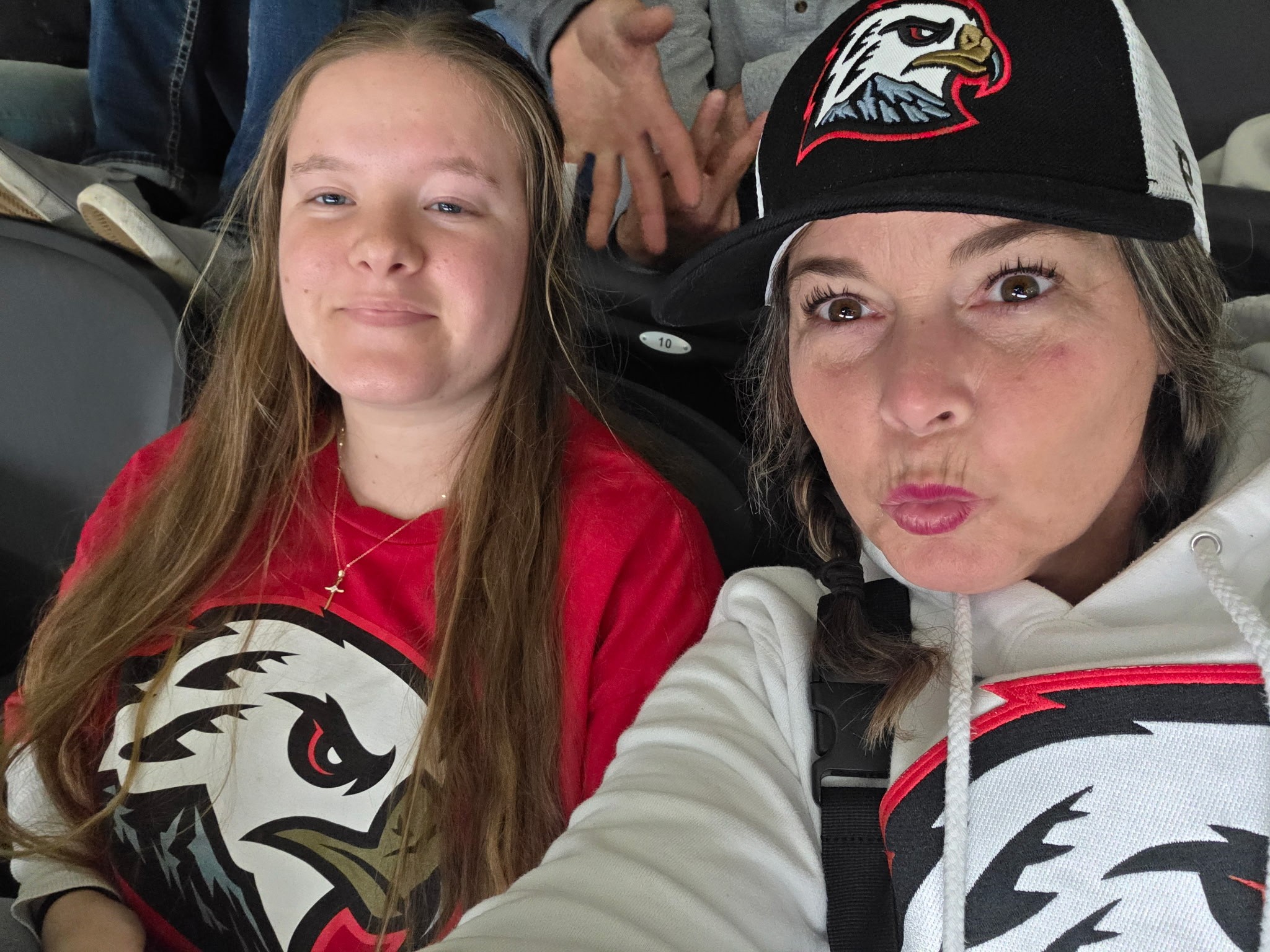 Liz and Cloe sitting together at a game