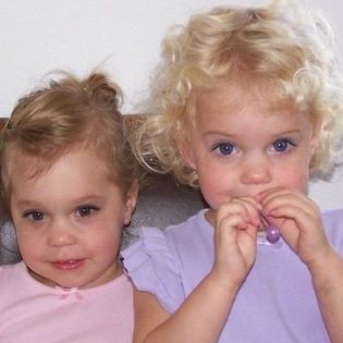 Two young children sitting together